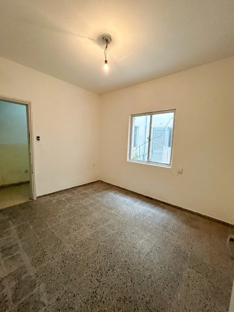 Un dormitorio en planta baja con patio, Villa Dolores